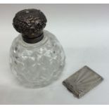 A silver topped hobnail cut scent bottle together