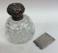 A silver topped hobnail cut scent bottle together