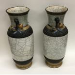A pair of Chinese crackleware vases with flower de