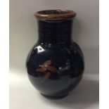 BLANOT: A large French brown glazed pottery vase o