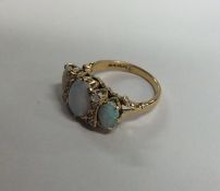 An 18 carat gold opal and diamond nine stone ring