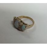 An 18 carat gold opal and diamond nine stone ring