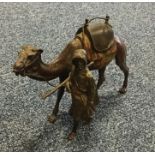 A large cold painted bronze depicting a camel with