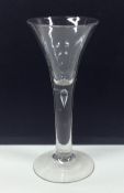 A rare Georgian tapering wine glass with plain ste