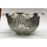 A large Indian silver bowl attractively decorated