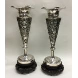 A tall pair of Chinese silver spill vases of taper