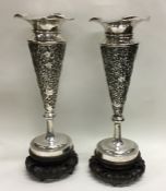 A tall pair of Chinese silver spill vases of taper