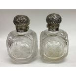 A matched pair of Victorian silver topped scent bo