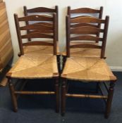 A set of four cane seated chairs. Est. £20 - £30.