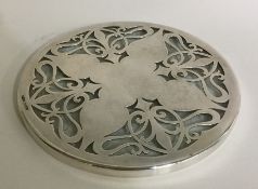 A heavy silver mounted glass teapot stand decorate