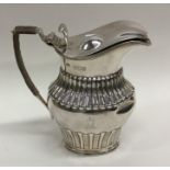 An Edwardian silver half fluted water jug. London.