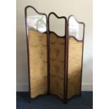 A stylish glass and mahogany threefold screen. Est