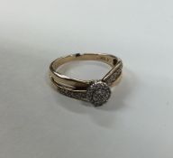 A 10 carat gold diamond cluster ring of circular f
