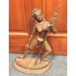 A tall Eastern figure of a lady dancing. Approx. 4