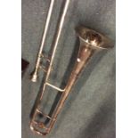 A large silver plated trombone. Est. £50 - £80.