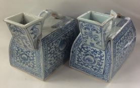 A pair of Chinese blue and white water jugs with s