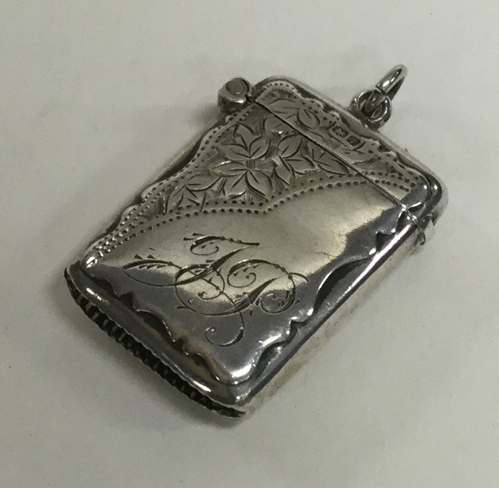 An Edwardian silver engraved vesta case. Birmingha