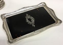 A large silver and tortoiseshell inlaid tray decor