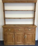 A good stripped pine three drawer kitchen dresser