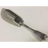A heavy George III silver fish slice with pierced