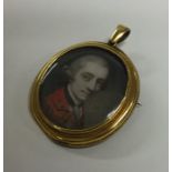 An oval gold miniature with loop top and locket ba