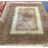 An old rug decorated in bright colours. Est. £30 -
