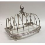 A large George III seven bar silver toast rack on