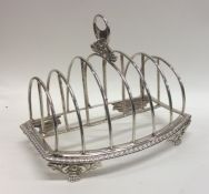 A large George III seven bar silver toast rack on