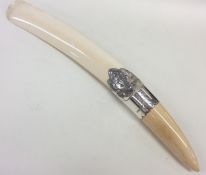 An Edwardian silver letter opener decorated with s