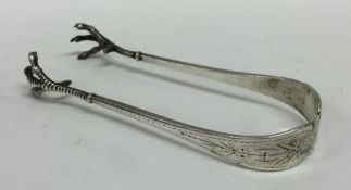 A pair of Norwegian silver sugar tongs with engrav