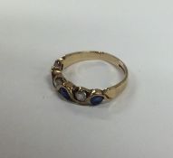 A sapphire and diamond six stone ring. Approx. 2 g