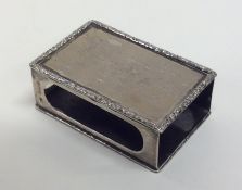 An Edwardian silver matchbox holder with engine tu