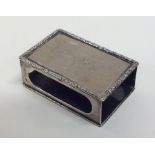 An Edwardian silver matchbox holder with engine tu