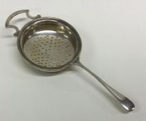 An Edwardian silver tea strainer. Birmingham. By A