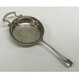 An Edwardian silver tea strainer. Birmingham. By A