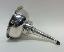 A good quality crested silver wine funnel with tur