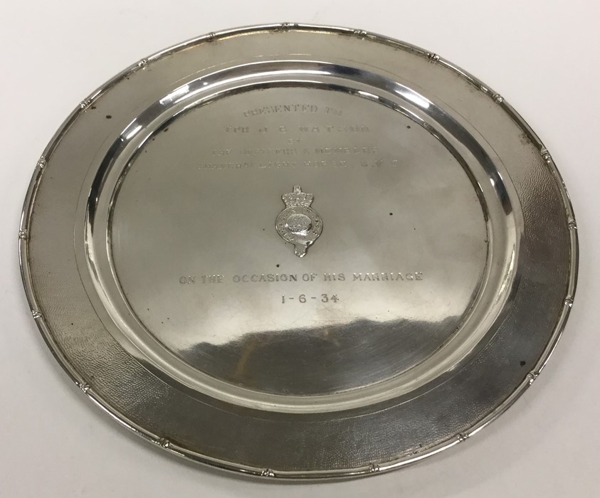 A Chinese silver circular salver with bamboo effec