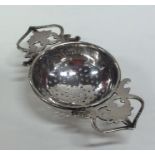 An Edwardian silver tea strainer. Birmingham. Appr