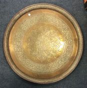 A large Eastern brass charger. Approx. 49 cms in d