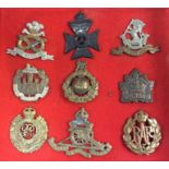 A set of nine Military cap badges. Est. £20 - £30.