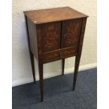 A Dutch marquetry two door side table on tapering