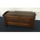 An oak dome top coffer with shaped front. Est. £30