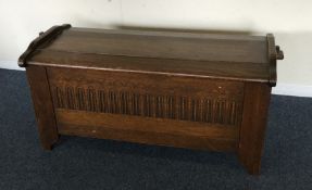 An oak dome top coffer with shaped front. Est. £30