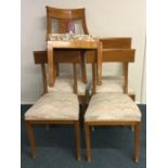 A good set of four maple wood dining chairs on tap
