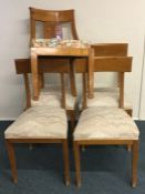 A good set of four maple wood dining chairs on tap