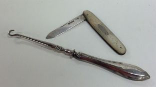 A silver mounted fruit knife together with a butto