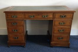 An Edwardian mahogany nine drawer desk. Est. £80 -