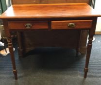 An Edwardian two drawer writing desk. Est. £20 - £