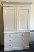 A painted pine four drawer linen press. Est. £80 -