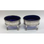 A pair of large George III silver salts with openw